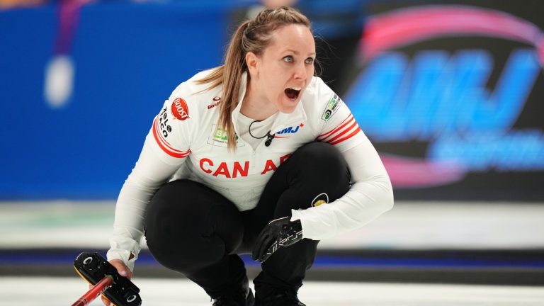 Canada's skip Rachel Homan yells after delivering a rock during World Women’s Curling Championship action against Sweden in Sydney, N.S. on Saturday, March 16, 2024. (Darren Calabrese/CP)