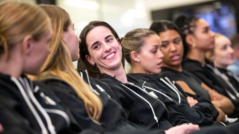 Iowa's Caitlin Clark, center, awaits her NCAA college basketball team's seed reveal during a "Selection Sunday" watch party Sunday, March 17, 2024, at Carver-Hawkeye Arena in Iowa City, Iowa. (Geoff Stellfox/The Gazette via AP)