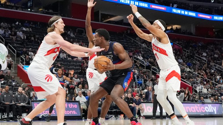 Detroit Pistons center Jalen Duren (0) is defended by Toronto Raptors forward Kelly Olynyk, left, and forward Bruce Brown (11) during the second half of an NBA basketball game, Wednesday, March 13, 2024, in Detroit. (Carlos Osorio/AP)