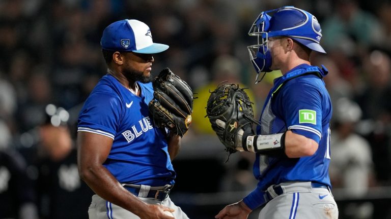 Toronto Blue Jays pitcher Juan Nunez, left, talks with catcher Brian Serven during the second inning of a spring training baseball game Friday, March 1, 2024, in Tampa, Fla. (Charlie Neibergall/AP)