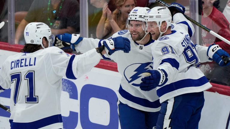 Tampa Bay Lightning centre Steven Stamkos, right, celebrates his goal with centre Anthony Cirelli (71) and left wing Brandon Hagel, centre, during the first period of an NHL hockey game against the Florida Panthers, Saturday, March 16, 2024, in Sunrise, Fla. (Wilfredo Lee/AP)