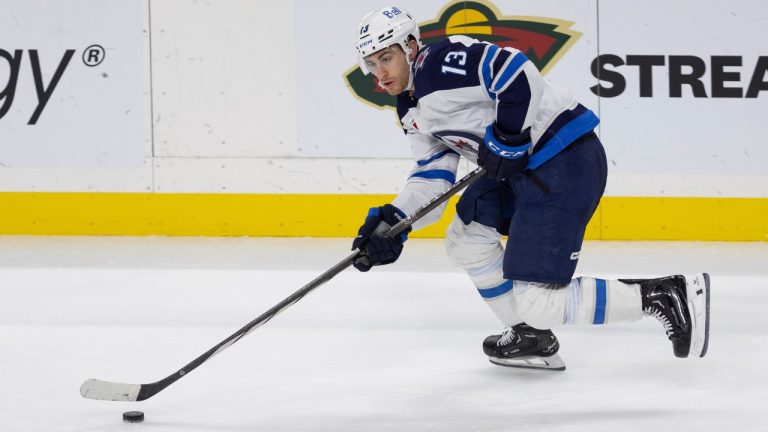 Winnipeg Jets center Gabriel Vilardi (13) skates with the puck during the third period of an NHL hockey game against the Minnesota Wild, Sunday, Dec. 31, 2023, in St. Paul, Minn. (Bailey Hillesheim/AP)