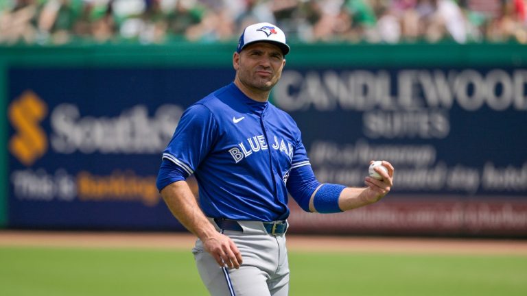 Toronto Blue Jays’ Joey Votto loosens up before a spring training baseball game against the Philadelphia Phillies at BayCare Ballpark, Sunday, March 17, 2024, in Clearwater, Fla. (Steve Nesius/THE CANADIAN PRESS)