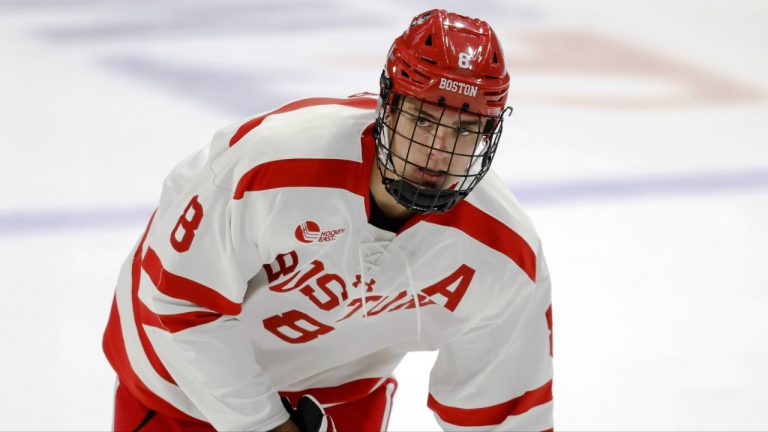 Boston University defenseman Cade Webber (8) shoots before the start of an NCAA hockey game against Massachusetts on Friday, Oct. 27, 2023, in Boston. (Greg M. Cooper/AP)