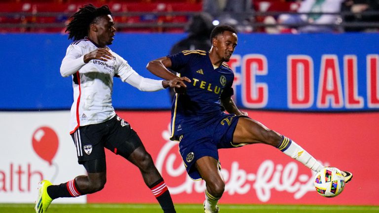 Vancouver Whitecaps' Ali Ahmed, right, tries to control the ball against FC Dallas' Herbert Endeley during the second half of an MLS soccer match, Saturday, March 16, 2024, in Frisco, Texas. The Whitecaps won 3-1. (Julio Cortez/AP)