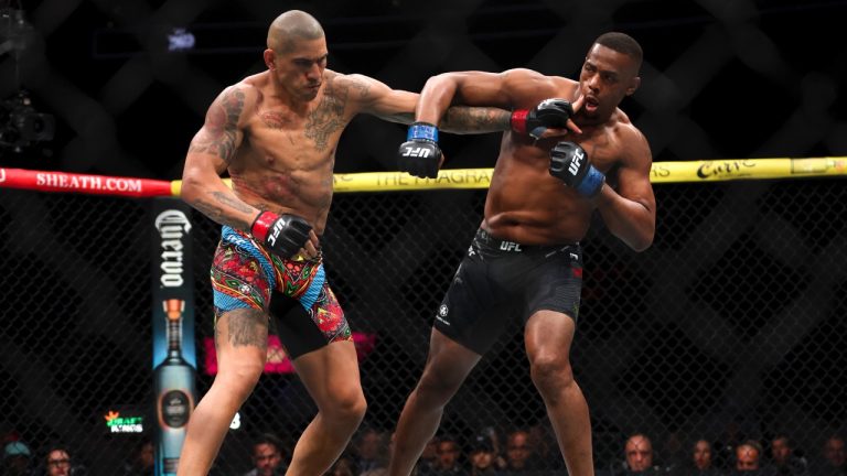 Alex Pereira, left, fights Jamahal Hill during a UFC 300 mixed martial arts light-heavyweight title bout in Las Vegas. (Ellen Schmidt/Las Vegas Review-Journal via AP)