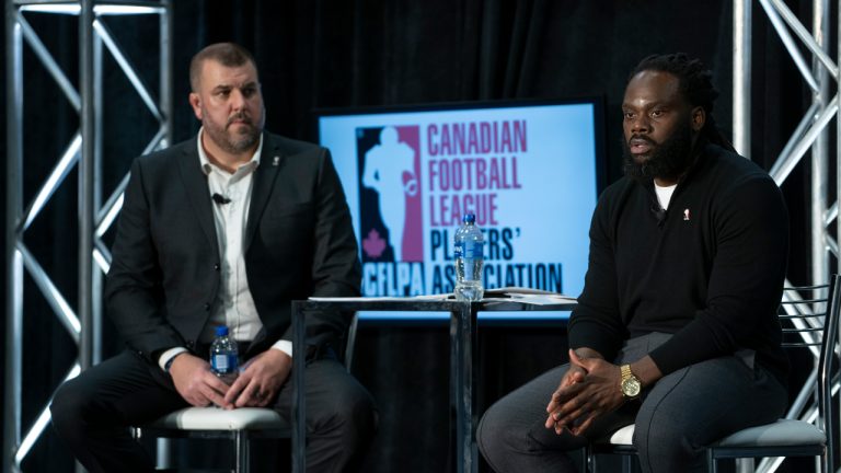 CFLPA executive director Brian Ramsay, left, and president Solomon Elimimian deliver their State of the Union address in November 2023. (Peter Power/CP)