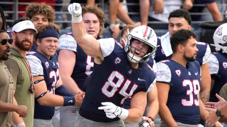 Arizona tight end Tanner McLachlan (84) reacts after making a play against Utah during the first half of an NCAA college football game, Saturday, Nov. 18, 2023, in Tucson, Ariz. (Rick Scuteri/AP)