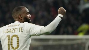 Lyon's Alexandre Lacazette celebrates after scoring his side's second goal during the French League One soccer match between Lyon and Rennes at the Groupama stadium, outside Lyon, France, Friday, Jan. 26, 2024. (Laurent Cipriani/AP)