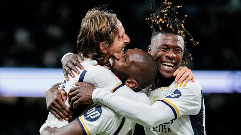 Real Madrid players celebrate after Rodrygo scored the opening goal during a Spanish La Liga soccer match between Real Madrid and Athletic Bilbao at the Santiago Bernabeu stadium in Madrid, Spain, Sunday, March 31, 2024. (M. Gracia Jimenez/AP) 