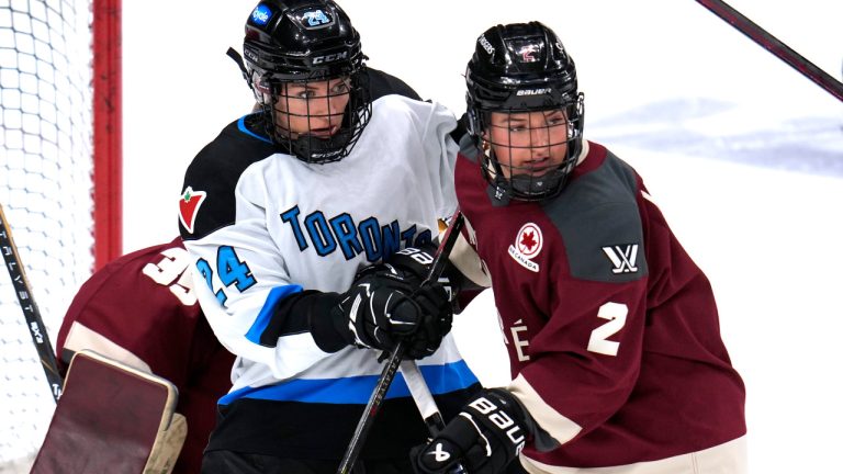 Toronto's Natalie Spooner (24) screens Montreal goalie Ann-Renee Destines (35) with Mariah Keopple (2) defending during the first period of an PWHL hockey game in Pittsburgh, Sunday, March 17, 2024. (AP Photo/Gene J. Puskar) 