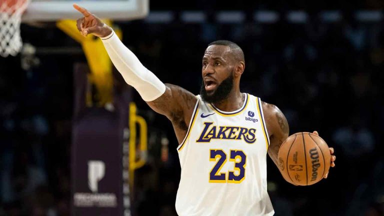 Los Angeles Lakers forward LeBron James (23) directs his teammates as he dribbles up the court during the first half of an NBA basketball game against the Cleveland Cavaliers, Saturday, April 6, 2024, in Los Angeles. (William Liang/AP)