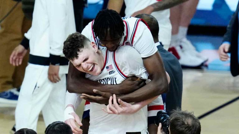 UConn center Youssouf Singare, rear, hugs orward Alex Karaban after the NCAA college basketball game against Alabama at the Final Four, Saturday, April 6, 2024, in Glendale, Ariz. (Ross D. Franklin/AP)