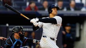 New York Yankees' Juan Soto, right, follows through on a home run against the Miami Marlins during the fourth inning of a baseball game, Monday, April 8, 2024, in New York. (Noah K. Murray/AP)