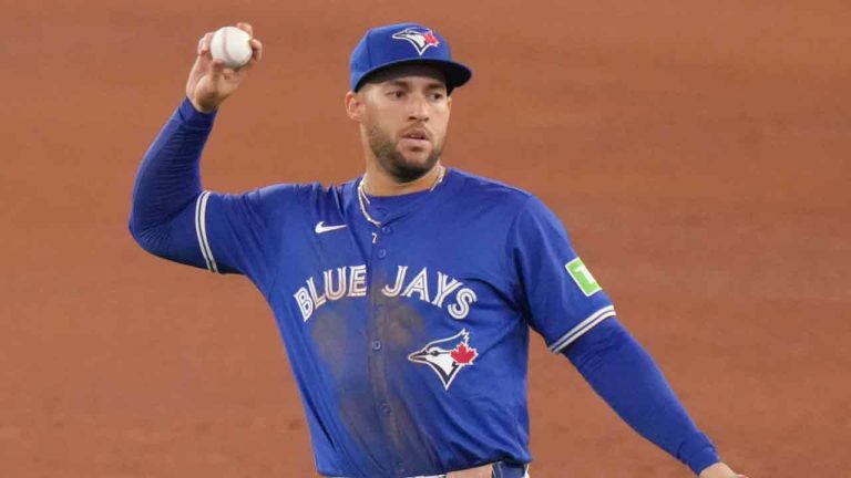 Toronto Blue Jays outfielder George Springer tosses the ball between innings during interleague baseball action against the Colorado Rockies in Toronto, Saturday, April 13, 2024. (Chris Young/CP)