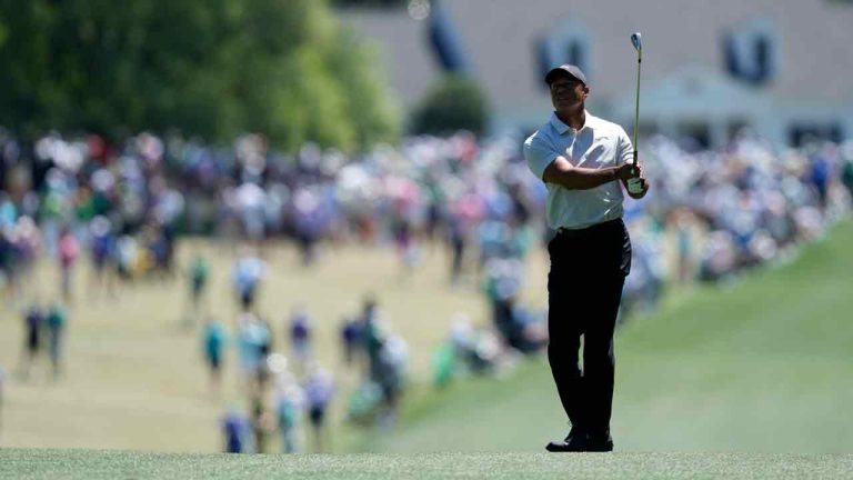 Tiger Woods hits from the fairway on the first hole during third round at the Masters golf tournament at Augusta National Golf Club Saturday, April 13, 2024, in Augusta, Ga. (David J. Phillip/AP)