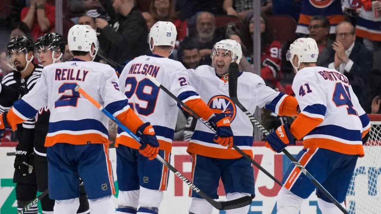 New York Islanders' Brock Nelson (29) celebrates with teammates, including Kyle Palmieri, second from right, after scoring during the second period of an NHL hockey game against the New Jersey Devils in Newark, N.J., Monday, April 15, 2024. (Seth Wenig/AP)