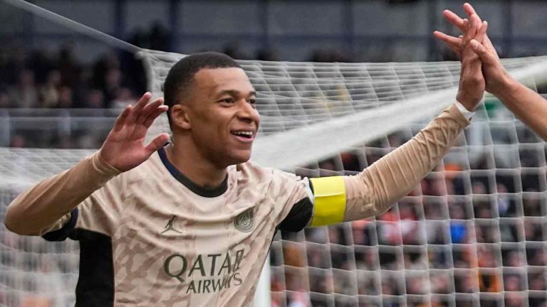 PSG's Kylian Mbappe celebrates scoring his side's second goal during the French League One soccer match between Lorient and Paris Saint-Germain at the Moustoir stadium in Lorient, Brittany, western France, Wednesday, April 24, 2024. (Michel Euler/AP)