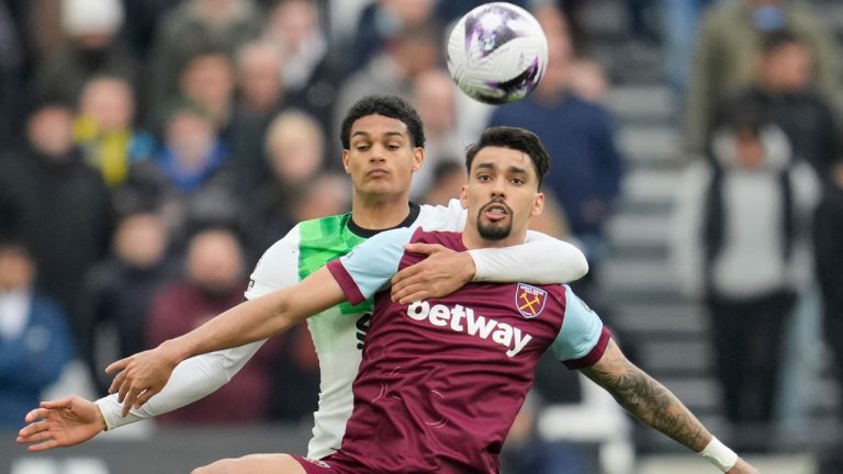 West Ham's Lucas Paqueta, right, and Liverpool's Jarell Quansah battle for the ball during the English Premier League soccer match between West Ham United and Liverpool at London stadium in London, Saturday, April 27, 2024. (Kin Cheung/AP) 