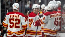 Kuzmenko has hat trick as Flames hold off Ducks