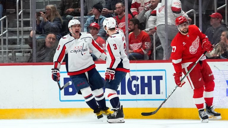 Washington Capitals left wing Alex Ovechkin (8) celebrates his goal with Nick Jensen (3) as Detroit Red Wings left wing David Perron (57) skates away in the second period of an NHL hockey game Tuesday, April 9, 2024, in Detroit. (Paul Sancya/AP)