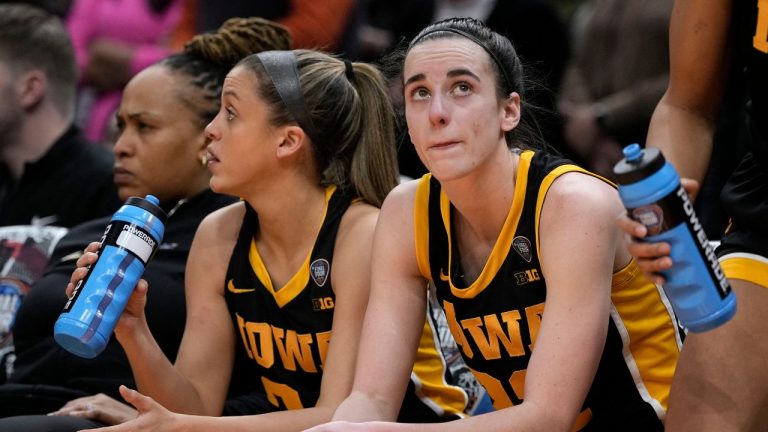 Iowa guard Caitlin Clark sits on the bench at the end of the Final Four college basketball championship game against South Carolina in the women's NCAA Tournament, Sunday, April 7, 2024, in Cleveland. (Morry Gash/AP Photo)