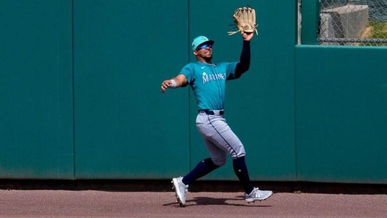 Seattle Mariners' Jonatan Clase fields fly out hit by Oakland Athletics' Ryan Noda during the second inning of a spring training baseball game, Tuesday, March 12, 2024, in Mesa, Ariz. (Matt York/AP Photo)