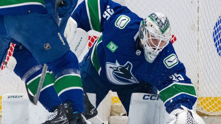 Vancouver Canucks goaltender Thatcher Demko covers the puck during the first period of an NHL game against the Winnipeg Jets, in Vancouver, Saturday, March 9, 2024. (Ethan Cairns/CP Photo)