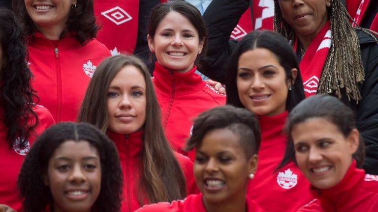 Diana Matheson, top centre, of Oakville, Ont., stands for a photograph with her Canadian national women's soccer teammates after the roster for the 2015 FIFA Women's World Cup was announced, in Vancouver, B.C., on Monday April 27, 2015. THE CANADIAN PRESS/Darryl Dyck