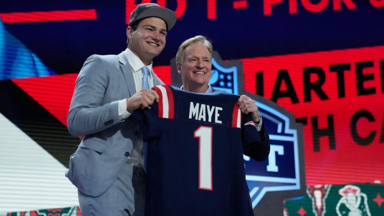 North Carolina quarterback Drake Maye poses with NFL commissioner Roger Goodell after being chosen by the New England Patriots with the third overall pick during the first round of the NFL football draft, Thursday, April 25, 2024, in Detroit. (Jeff Roberson/AP Photo)