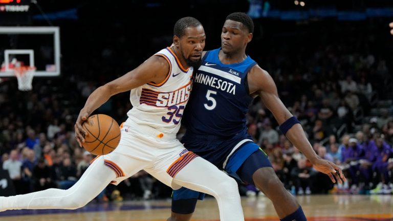 Phoenix Suns forward Kevin Durant drives against Minnesota Timberwolves guard Anthony Edwards (5) during the first half of an NBA basketball game. (AP Photo/Rick Scuteri)