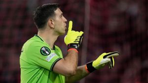 Aston Villa's goalkeeper Emiliano Martinez reacts during the penalties in the Europa Conference League quarter final second leg soccer match between Lille and Aston Villa. (Christophe Ena/AP)