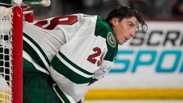 Minnesota Wild's goalie Marc-Andre Fleury takes a breather while his helmet is replaced during the third period of the team's NHL hockey game against the Arizona Coyotes on Wednesday, Feb. 14, 2024, in Tempe, Ariz. (Darryl Webb/AP Photo)