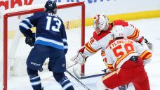 Jets clinch playoff berth with win over Flames