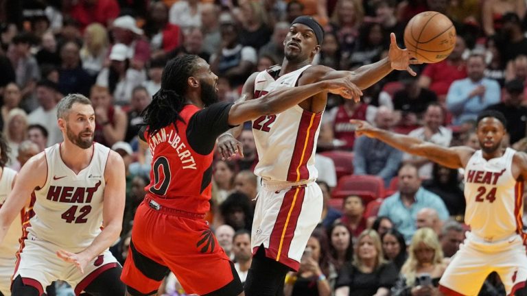 Miami Heat forward Jimmy Butler blocks a pass by Toronto Raptors guard Javon Freeman-Liberty during the first half of an NBA basketball game, Friday, April 12, 2024, in Miami. (Marta Lavandier/AP Photo)