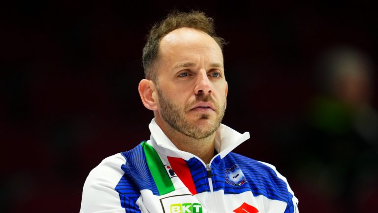 Italy's Joel Retornaz earned a 7-6 victory over Canada's Brad Gushue on Monday at the world men's curling championship. (CP/Sean Kilpatrick)