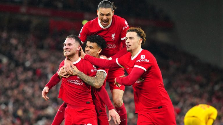 Liverpool's Alexis Mac Allister, left, celebrates with teammates after scoring his side's second goal during the English Premier League soccer match between Liverpool and Sheffield United at the Anfield stadium in Liverpool, England, Thursday, Apr. 4, 2024. (AP/Jon Super)