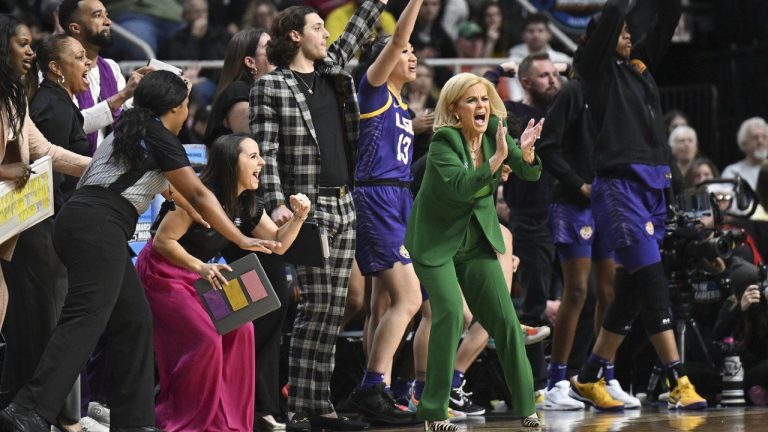 LSU head coach Kim Mulkey and the LSU bench react during the first quarter of an Elite Eight round college basketball game against Iowa during the NCAA Tournament, Monday, April 1, 2024, in Albany, N.Y. (Hans Pennink/AP)