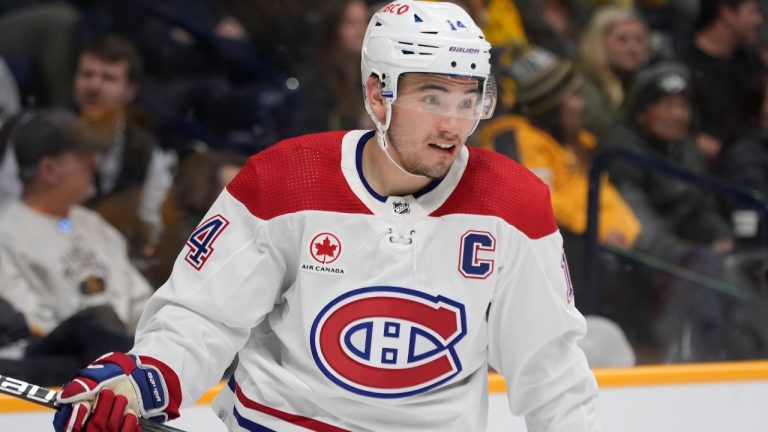 Montreal Canadiens centre Nick Suzuki (14) plays during the first period of an NHL hockey game against the Nashville Predators, Tuesday, March 5, 2024, in Nashville, Tenn. (AP Photo/George Walker IV)