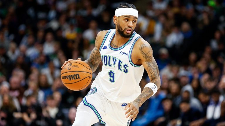 Minnesota Timberwolves guard Nickeil Alexander-Walker (9) dribbles during the second half of an NBA basketball game against the Memphis Grizzlies Thursday, Jan. 18, 2024, in Minneapolis. (AP Photo/Matt Krohn)