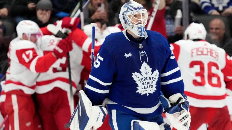 Toronto Maple Leafs goaltender Ilya Samsonov (35) skates off as Detroit Red Wings centre Dylan Larkin (71) celebrates with teammates after scoring the game-winning goal in overtime NHL hockey action against the Toronto Maple Leafs, in Toronto, Saturday, April 13, 2024. (Frank Gunn/CP)