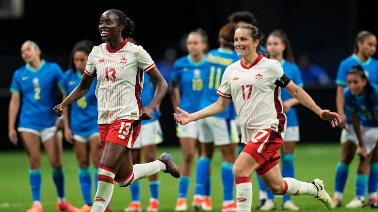 Canada's Simi Awujo, left, and Jessie Fleming celebrate winning in a shootout against Brazil in a SheBelieves Cup women’s soccer game, Saturday, April 6, 2024, in Atlanta. (Mike Stewart/AP)