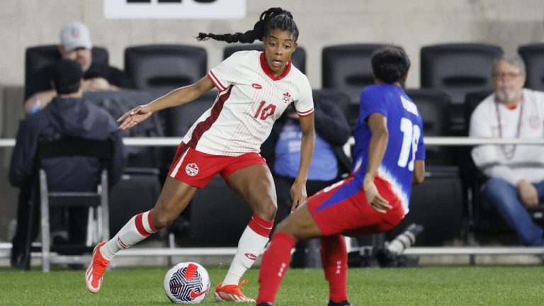 Canada's Ashley Lawrence tries to dribble around United States' Crystal Dunn during the second half of a SheBelieves Cup women's soccer match Tuesday, April 9, 2024, in Columbus, Ohio. (Jay LaPrete/AP Photo)
