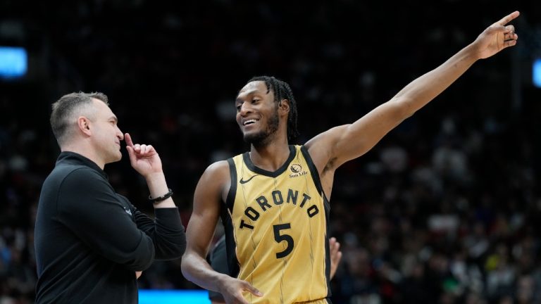 Toronto Raptors guard Immanuel Quickley (5) speaks with his head coach Darko Rajakovic during second half NBA basketball action against the Washington Wizards in Toronto on Sunday, April 7, 2024. (Frank Gunn/CP)