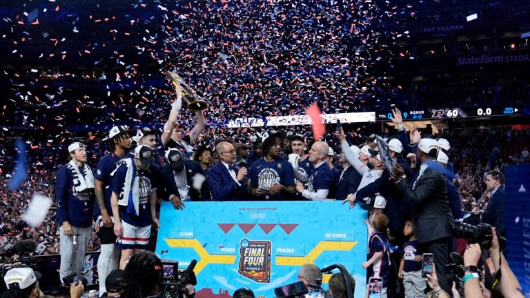 UConn players celebrate after the NCAA college Final Four championship basketball game against Purdue, Monday, April 8, 2024, in Glendale, Ariz. (Brynn Anderson/AP)