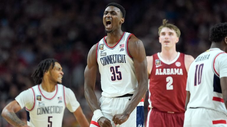 UConn forward Samson Johnson celebrates a basket during the second half of the NCAA college basketball game against Alabama. (Brynn Anderson/AP)