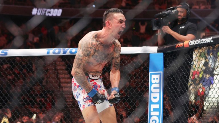 Max Holloway celebrates after knocking out Justin Gaethje in the fifth round of a lightweight BMF Title bout during UFC 300. (Steve Marcus/Las Vegas Sun via AP)