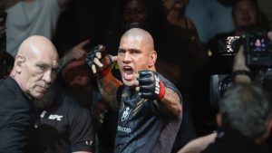 Alex Pereira mimes shooting an arrow before fighting Jamahal Hill at UFC 300. (Ellen Schmidt/Las Vegas Review-Journal via AP)