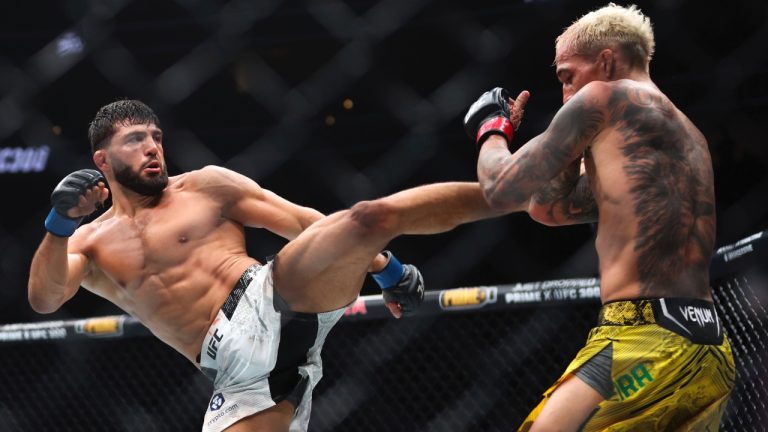 Arman Tsarukyan, left, kicks Charles Oliveira during a UFC 300 mixed martial arts lightweight bout in Las Vegas. (Ellen Schmidt/Las Vegas Review-Journal via AP)