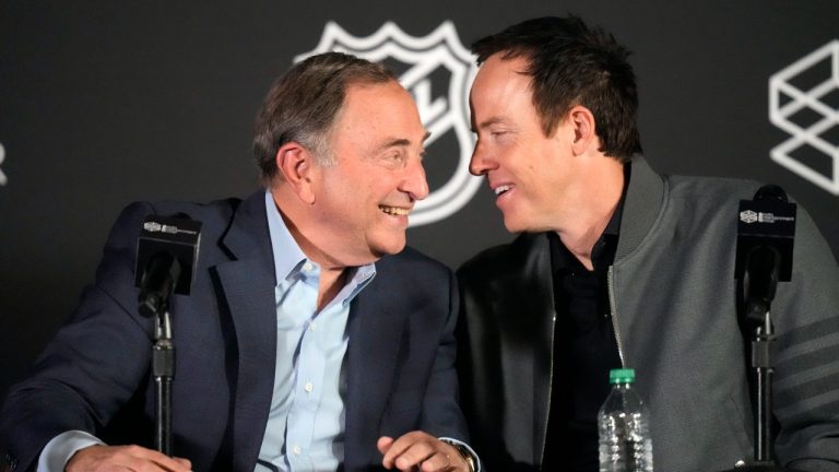 Gary Bettman, left, NHL commissioner, and Ryan Smith, co-founder and chairman of Smith Entertainment Group, speak during a news conference to celebrate the awarding of a new NHL team to Utah. (Rick Bowmer/AP)